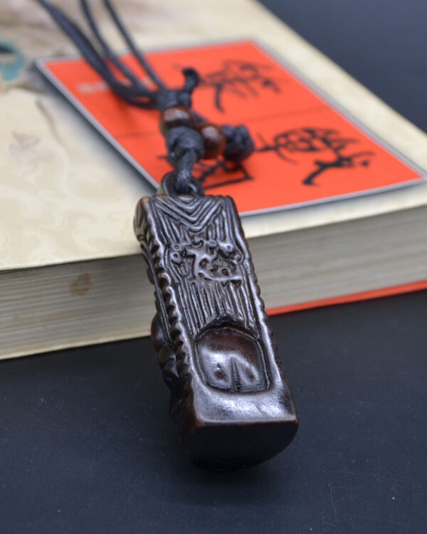 Collier tiki homme